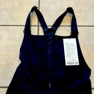 Woven air black lululemon size 4 overalls.  Excellent condition!
